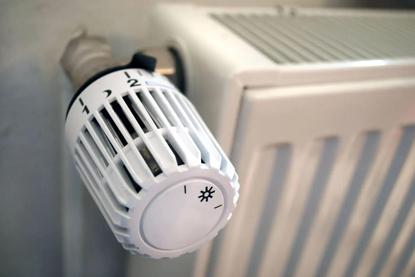 Macro of a white thermostat and heating
